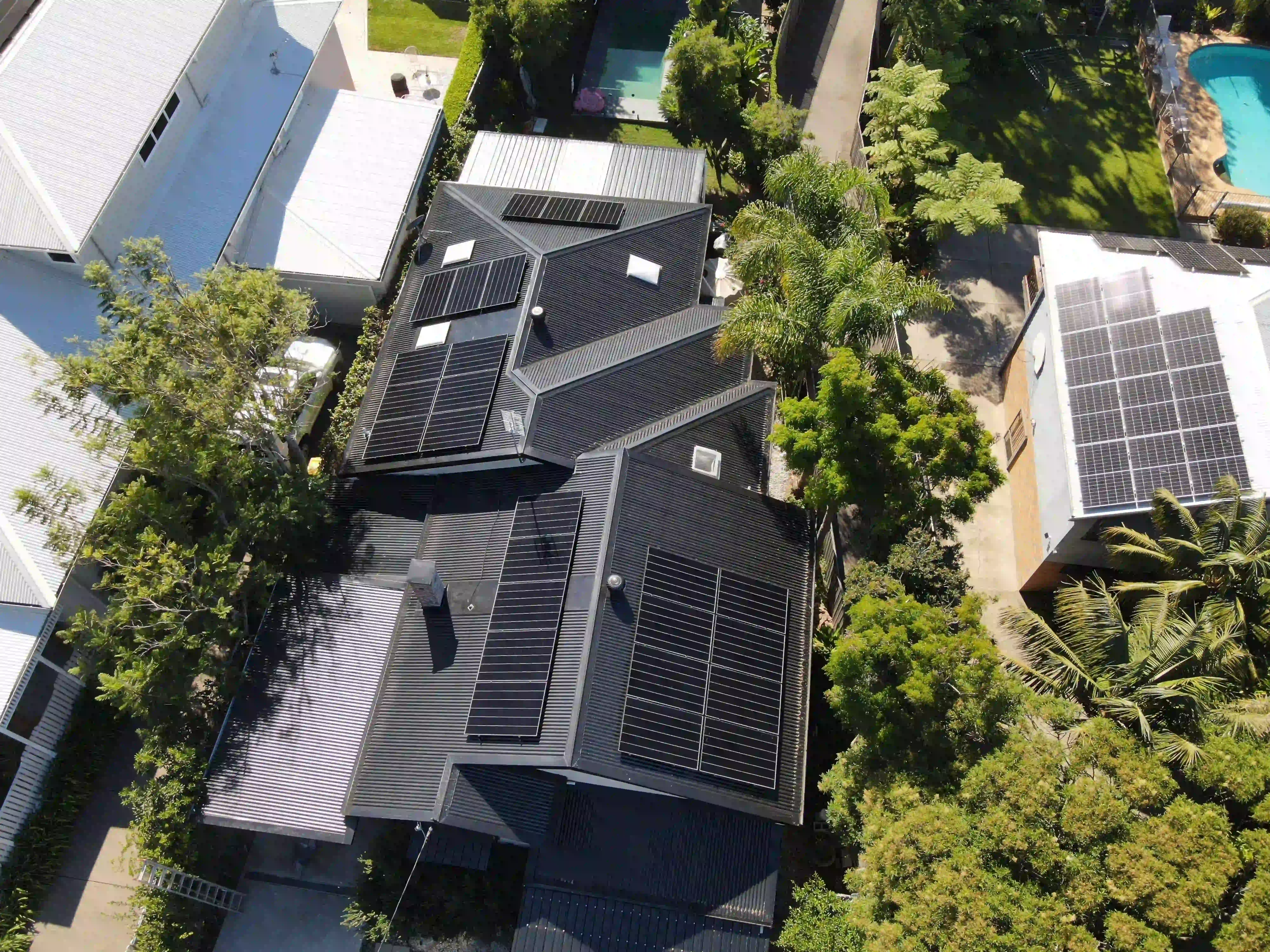 Wide aerial of a Merewether solar installation with the coastline beyond