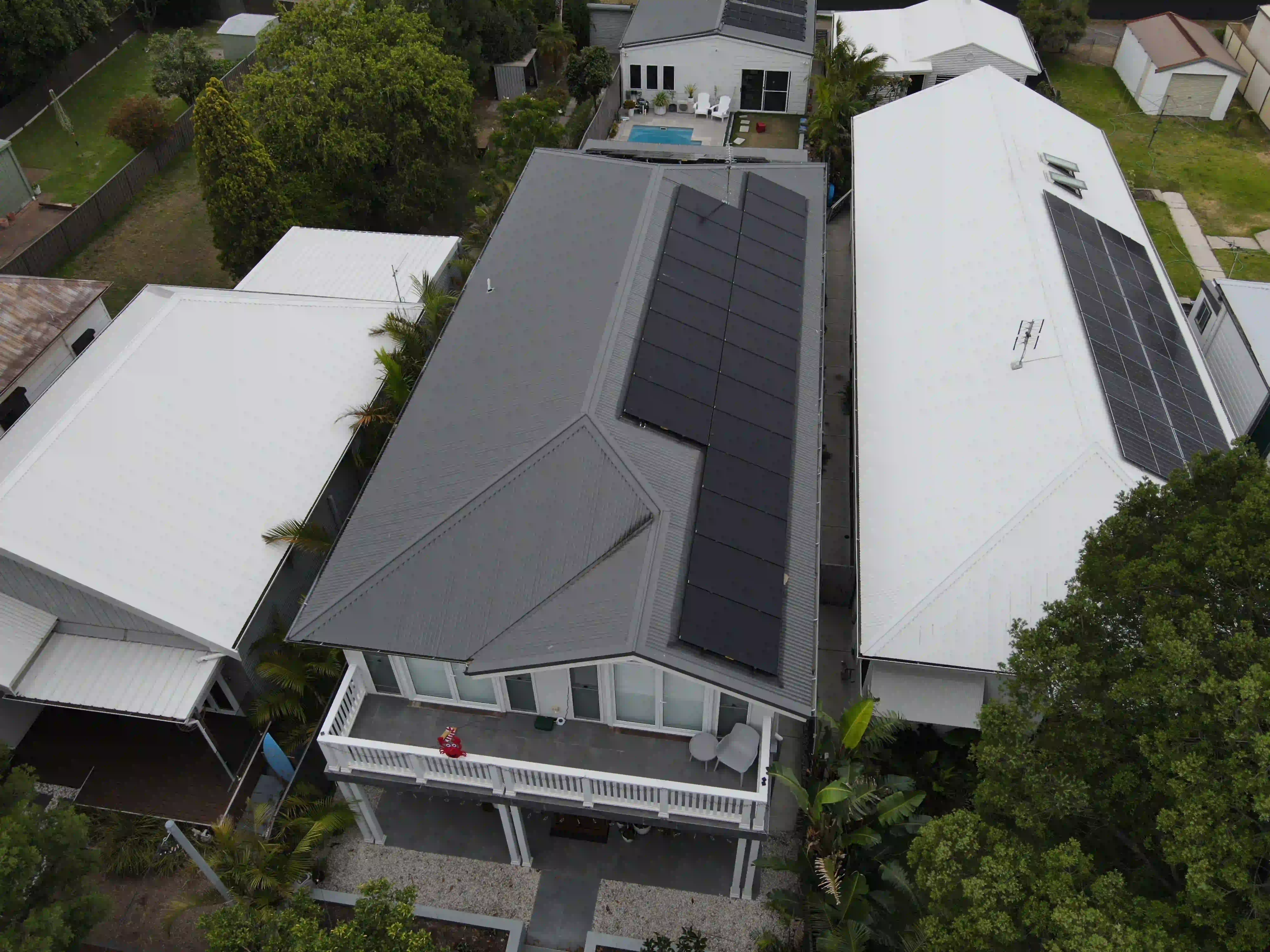 Drone view of rooftop solar panels installed by Newy Solar Co in Stockton, Newcastle