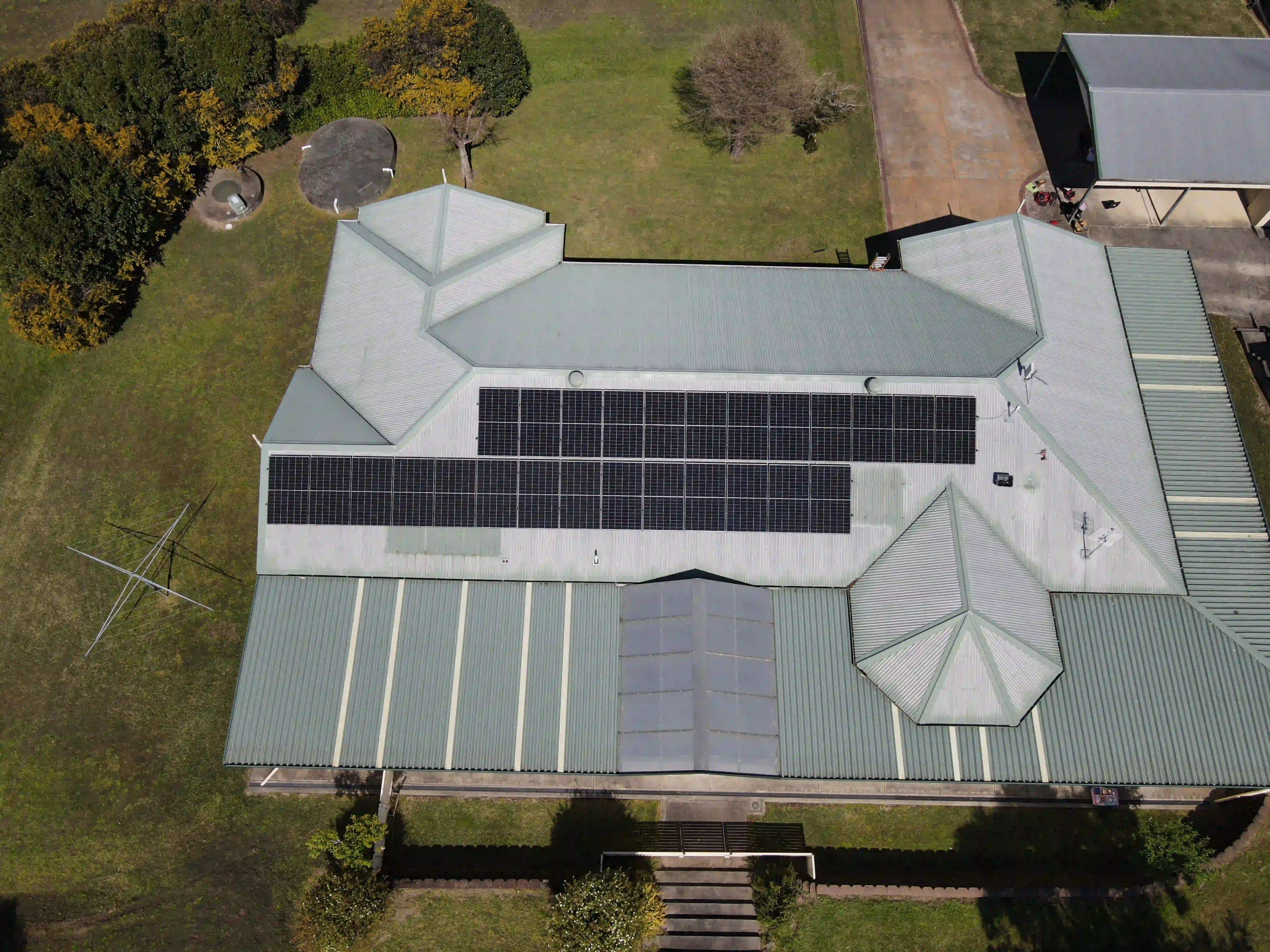 Drone view of a Newy Solar Co solar and battery installation on a rural property at Brandy Hill
