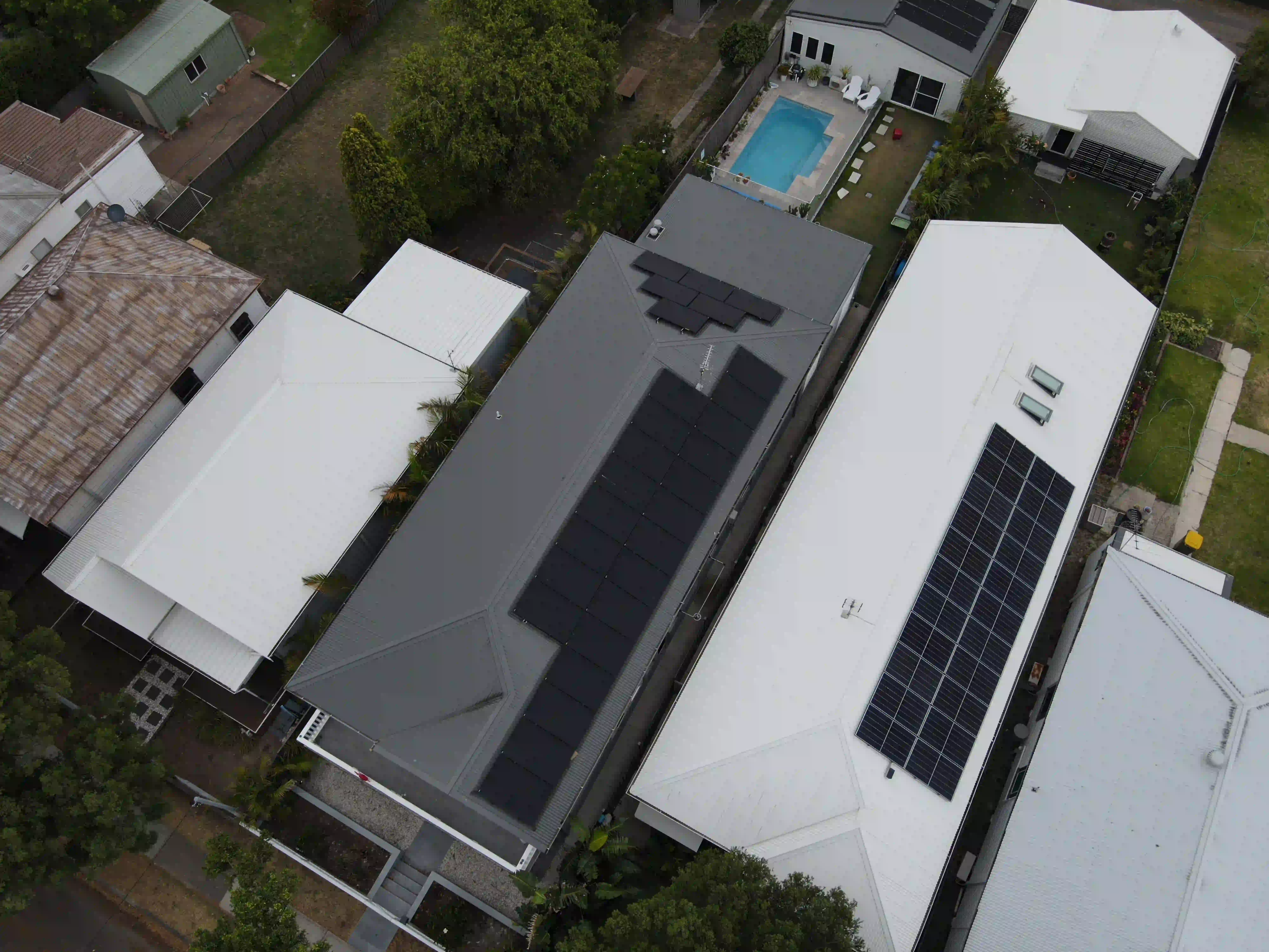 Overhead drone shot of a Stockton rooftop solar array