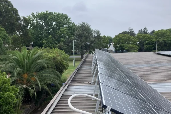 Row of solar panels on tilt legs falling down after incorrect installation