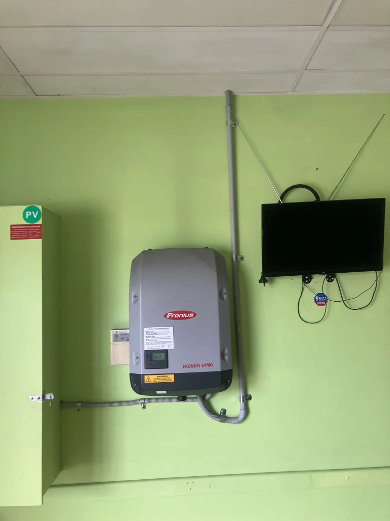 Solar conduit entering an inverter with no drain.